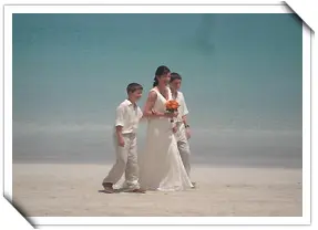 Bride with childrens with beach view